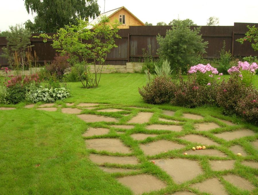 Natural stone on a green lawn