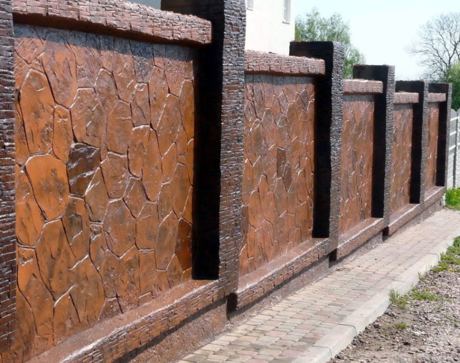 Facing the concrete fence with natural stone