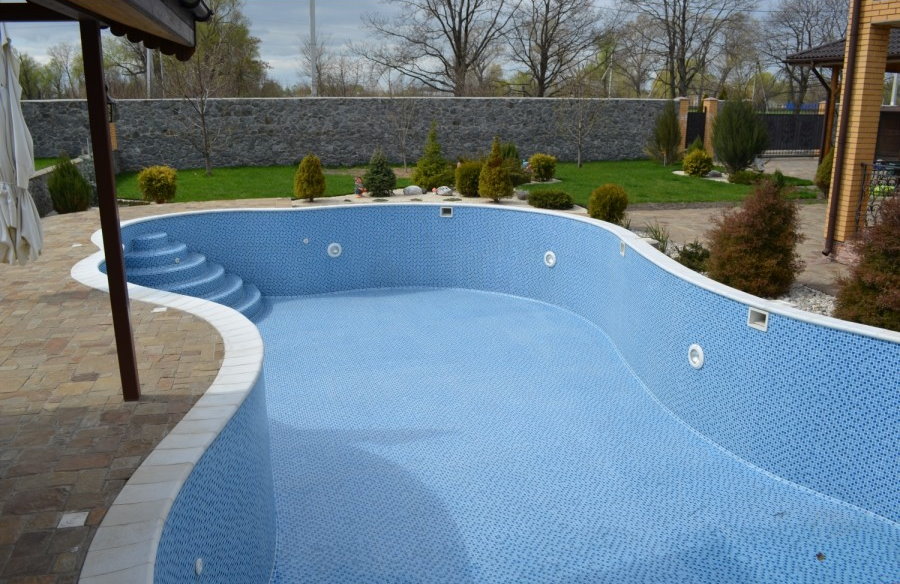 Mosaic tiles on the surfaces of the garden pool