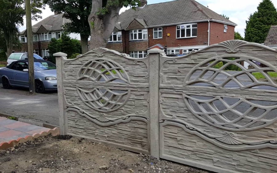 Concrete sectional fence at the border of the site