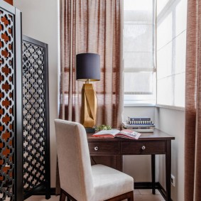 Wooden screen on an insulated loggia