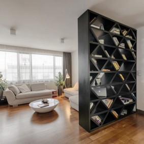 Black shelving on a wooden floor