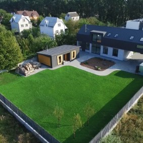 View of a rectangular plot with a one-story house