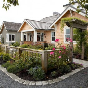 Wooden pergola in the front garden of a rural house