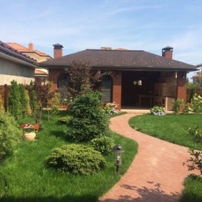 Gazebo with a summer kitchen in the back of the plot