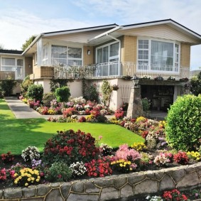 Natural stone border on a garden flower bed