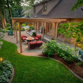 Wooden pergola in a recreation area on a plot