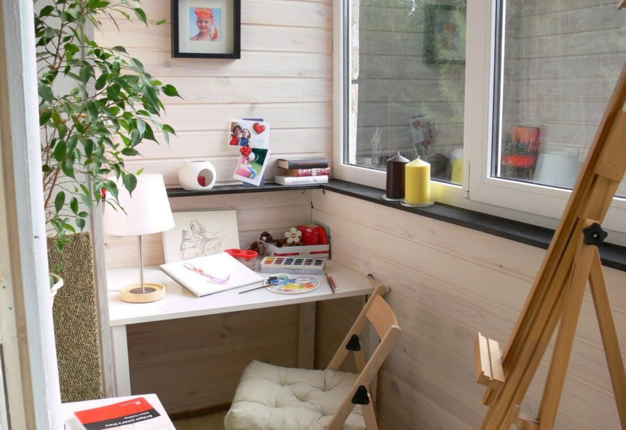 Easel on the balcony of a room for a girl