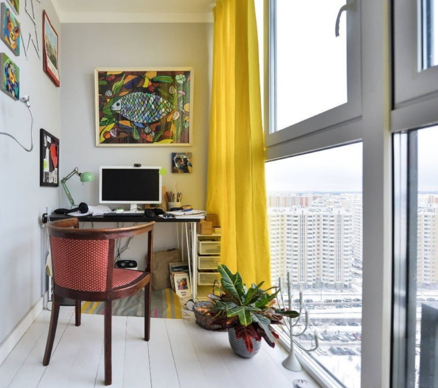 Yellow curtain on a large balcony window